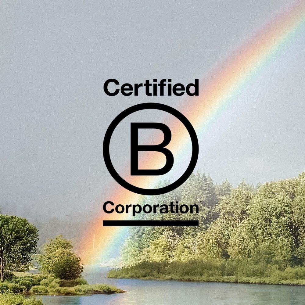 What does it mean to be a b corp? Benefit corporation logo with rainbow background.