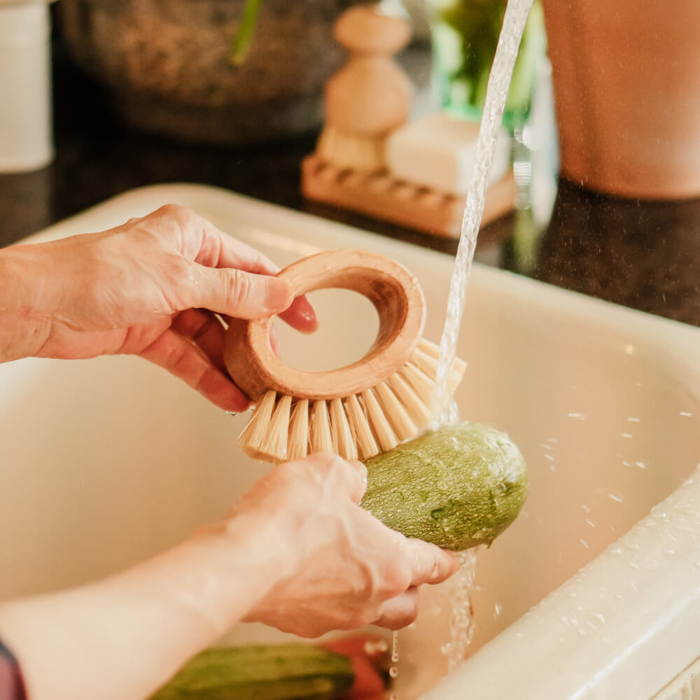 Hand washing vegetables.