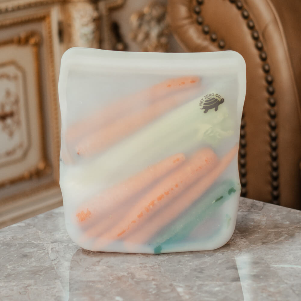 Jumbo Silicone Zip Sealer holding carrots celery zucchini.