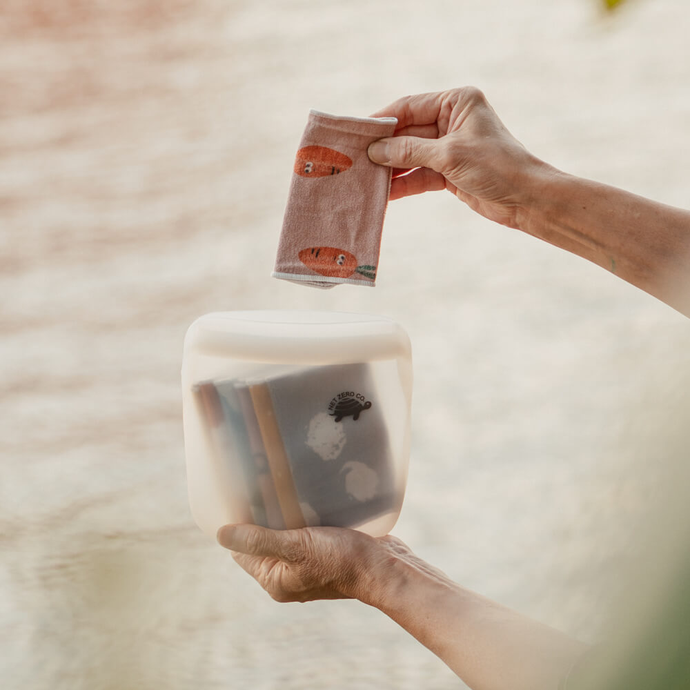 Reusable toilet paper cloths inside small Silicone Zip Sealer for tissues on the go.