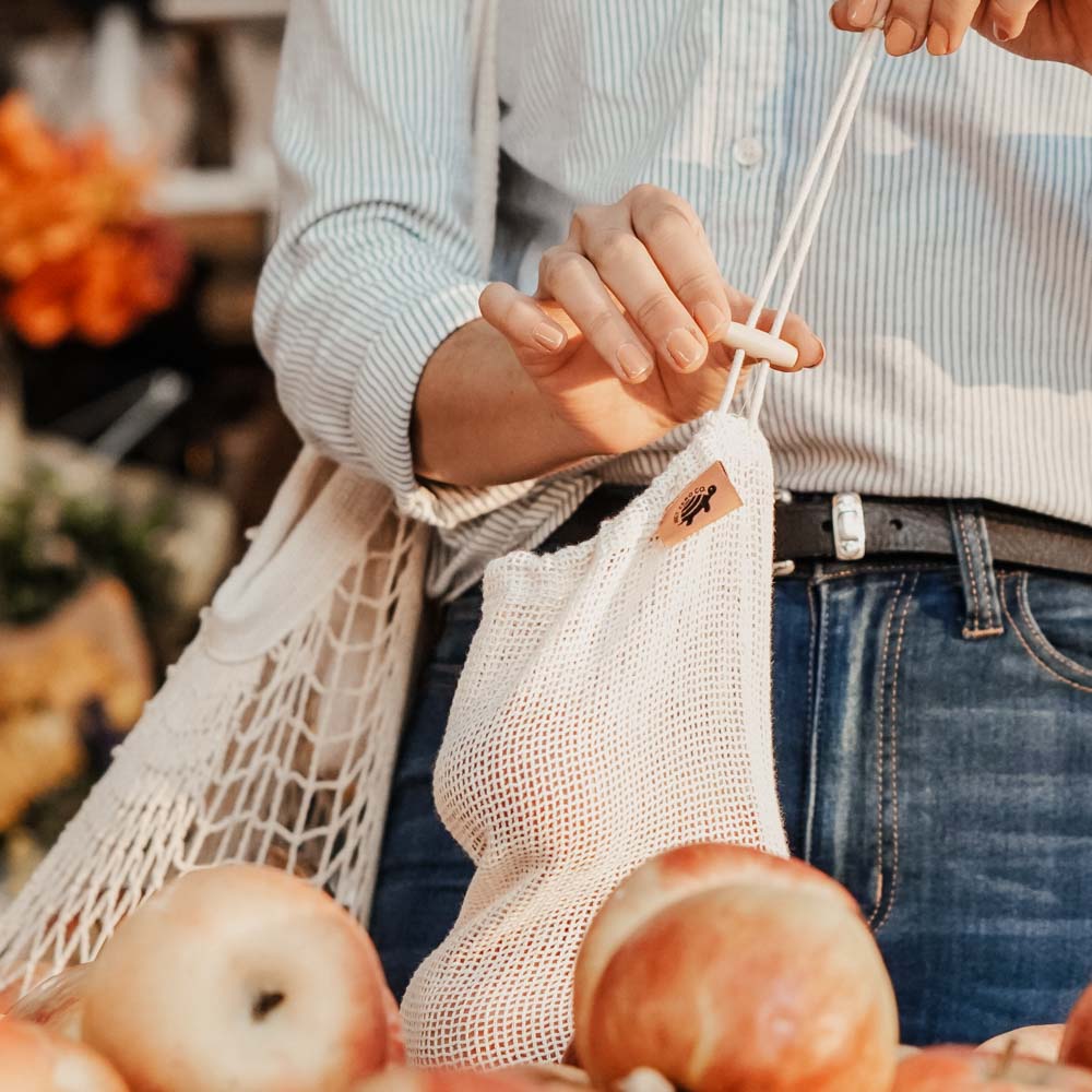 Grocery Shopping for Apples With Net Zero. Co Reusable Mesh Cotton Product Bags with a Wood Toggle